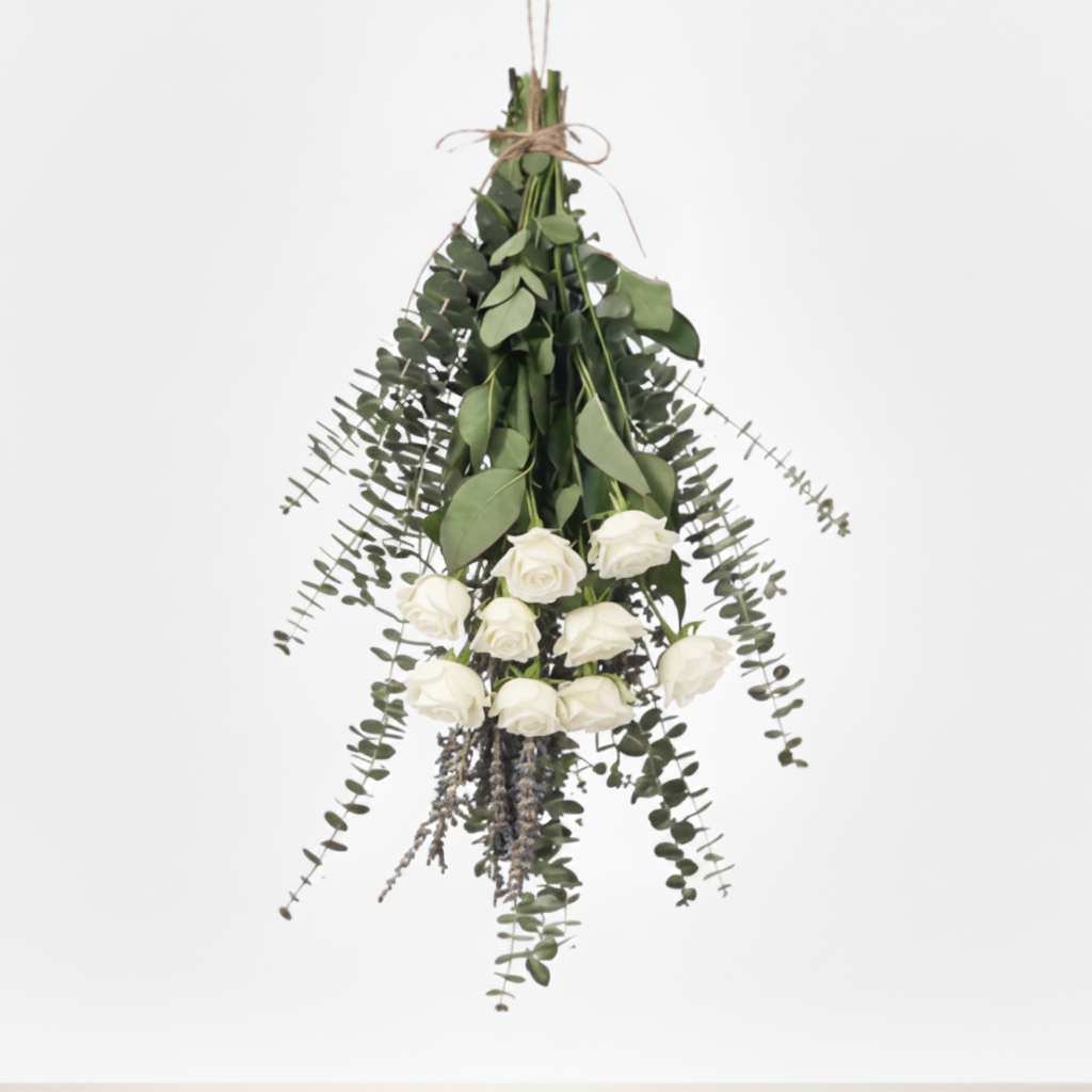 Hanging white roses and eucalyptus bundle arrangement