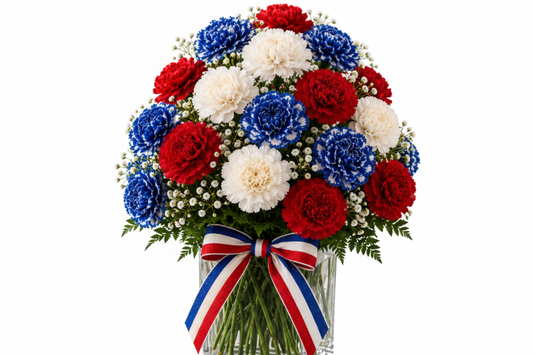 Red White and Bloom patriotic red white and blue carnation arrangement in clear glass vase with festive ribbon on white background