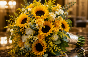 Sunflower and white rose bridal bouquet with greenery